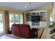 Cozy living room features built-in shelves and cabinets, with doors leading to an outdoor pool at 515 S Woodland Rd, Henderson, NC 27536