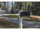 Street view of black mailbox that reads, 515 S. WOODLAND RD, sits in front of a well landscaped home at 515 S Woodland Rd, Henderson, NC 27536