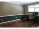 Office space featuring hardwood floors, two-tone paint and a large desk for productivity at 515 S Woodland Rd, Henderson, NC 27536