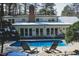 Relaxing backyard pool with lounge chairs and seamless access to home at 515 S Woodland Rd, Henderson, NC 27536