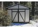 Well maintained shed with double doors for extra storage with a fresh coat of paint at 515 S Woodland Rd, Henderson, NC 27536