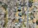 High angle view of the property situated among neighboring homes, highlighting its proximity to a nearby street at 5704 Whippoorwill St, Durham, NC 27704