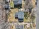 Aerial view of the property showcasing the layout, including the backyard deck and surrounding neighborhood at 5704 Whippoorwill St, Durham, NC 27704