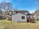 Backyard exterior of home featuring a deck, patio, and fenced in yard at 5704 Whippoorwill St, Durham, NC 27704
