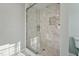 Bathroom featuring a marble shower with glass door at 5704 Whippoorwill St, Durham, NC 27704