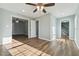 Bedroom with hardwood floors, fresh paint, and natural light at 5704 Whippoorwill St, Durham, NC 27704
