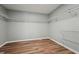 Walk-in closet with metal shelving and vinyl floors provides ample storage for an organized home at 5704 Whippoorwill St, Durham, NC 27704