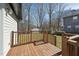 View from deck overlooking the property's landscaped backyard and providing a private outdoor space at 5704 Whippoorwill St, Durham, NC 27704