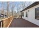 Spacious wooden deck showcasing a seamless transition to the backyard and ample space for outdoor enjoyment at 5704 Whippoorwill St, Durham, NC 27704