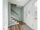 Inviting foyer featuring an elegant front door with decorative glass and wood-look flooring at 5704 Whippoorwill St, Durham, NC 27704
