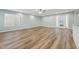 Living room features hardwood floors, ceiling fan and natural light at 5704 Whippoorwill St, Durham, NC 27704