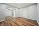 Open-concept living room with vinyl floors, neutral walls, and abundant natural light, perfect for entertaining at 5704 Whippoorwill St, Durham, NC 27704