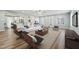 Bright living room with modern furniture, a large rug, and an open floor plan at 5704 Whippoorwill St, Durham, NC 27704