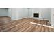 Spacious living room featuring stylish flooring, a fireplace, and fresh paint at 5704 Whippoorwill St, Durham, NC 27704