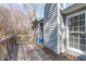 Exterior view of home and back deck with wood flooring and railings at 5900 Damon Ct, Raleigh, NC 27610