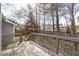 Wide back deck with wood flooring overlooking a tree-lined backyard at 5900 Damon Ct, Raleigh, NC 27610