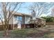 Rear exterior of home featuring backyard with mature trees at 5900 Damon Ct, Raleigh, NC 27610