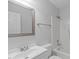 Clean bathroom with a white sink, toilet, and shower-tub combination at 5900 Damon Ct, Raleigh, NC 27610