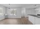 Bright dining area featuring a modern light fixture and barstool seating at 5900 Damon Ct, Raleigh, NC 27610