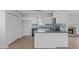 Updated kitchen with white cabinets, sleek countertops, and modern appliances at 5900 Damon Ct, Raleigh, NC 27610
