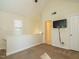 Bedroom with neutral colored walls, carpet, a TV and angled ceilings at 5917 Sentinel Dr, Raleigh, NC 27609