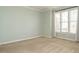 Bright and airy bedroom with neutral walls, plush carpeting, and ample natural light at 5917 Sentinel Dr, Raleigh, NC 27609