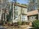 Charming two-story home with an exterior showcasing lush landscaping and lots of windows for natural light at 5917 Sentinel Dr, Raleigh, NC 27609
