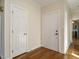 Light and bright foyer with hardwood floors and two large closets at 5917 Sentinel Dr, Raleigh, NC 27609