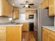 Updated kitchen with stainless steel appliances, light wood cabinets and granite counters at 5917 Sentinel Dr, Raleigh, NC 27609