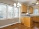 Bright kitchen nook with hardwood floors, granite counters, and natural light at 5917 Sentinel Dr, Raleigh, NC 27609