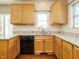 Kitchen showcasing granite countertops, stainless steel sink, and light wood cabinets at 5917 Sentinel Dr, Raleigh, NC 27609