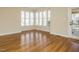 The living room has hardwood floors and lots of windows for natural light at 5917 Sentinel Dr, Raleigh, NC 27609
