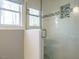 Modern shower with white subway tile, glass door, and a window for natural light at 5917 Sentinel Dr, Raleigh, NC 27609