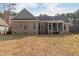 Backyard view of the brick house and screened-in porch at 6236 Annabella Rd, Rocky Mount, NC 27803