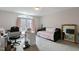 Spacious bedroom designed as an office with desk, sofa, mirror, and a bright window at 6236 Annabella Rd, Rocky Mount, NC 27803