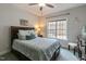 Comfortable bedroom featuring a ceiling fan, natural light from the window, and coastal accents at 6236 Annabella Rd, Rocky Mount, NC 27803
