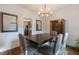 Formal dining room with modern lighting fixture, wood floors, and elegant decor at 6236 Annabella Rd, Rocky Mount, NC 27803