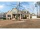 Charming brick home with a meticulously landscaped front yard, inviting curb appeal, and a detached two-car garage at 6236 Annabella Rd, Rocky Mount, NC 27803
