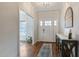 Bright foyer with hardwood floors, stylish console table, and a front door with sidelights at 6236 Annabella Rd, Rocky Mount, NC 27803