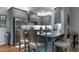 Modern kitchen with granite countertops, stainless steel appliances, and ample seating at the island at 6236 Annabella Rd, Rocky Mount, NC 27803
