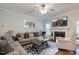 Well-appointed living room with a fireplace, comfortable seating, a ceiling fan, and natural light at 6236 Annabella Rd, Rocky Mount, NC 27803