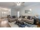 Spacious living room features a ceiling fan, two sofas, hardwood floor, and a stylish rug at 6236 Annabella Rd, Rocky Mount, NC 27803