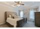 Serene main bedroom features a tray ceiling, ceiling fan, and soft, neutral decor at 6236 Annabella Rd, Rocky Mount, NC 27803