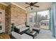 Outdoor screened porch with ceiling fan and comfortable seating area at 6236 Annabella Rd, Rocky Mount, NC 27803