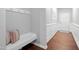 Entryway with a convenient bench, coat hooks, and direct access to the main living area at 624 Metro Station, Apex, NC 27502