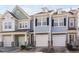 Charming townhome exterior featuring a single-car garage, stone accents, and a well-maintained facade in a desirable neighborhood at 624 Metro Station, Apex, NC 27502