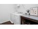 Bright laundry room features a counter and washer and dryer at 624 Metro Station, Apex, NC 27502