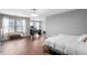 Main bedroom featuring natural light, a separate office space, and dark wood style flooring at 624 Metro Station, Apex, NC 27502