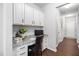 Bright office area featuring granite countertops, white cabinets, and dark wood floors at 624 Metro Station, Apex, NC 27502