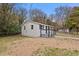 Well-maintained single-story home showcases neutral siding, dark shutters, and a inviting entrance at 700 Ross Rd, Lillington, NC 27546